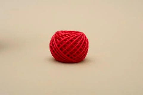 Red atangle thread on dark background - fabric Stock Photos