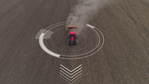 Red autonomous tractor seeding cereals or plowing arable land aerial. Stock Footage 167556740