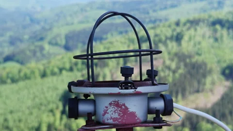 Red aviation warning light on 75m tower with mountain panorama Stock Footage 338115549