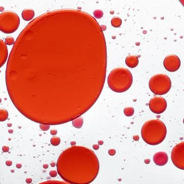 Red background, abstract oil bubble in water Stock Photos