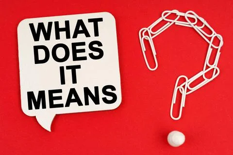 On a red background are a question mark made of paper clips and a sign with t Stock Photos