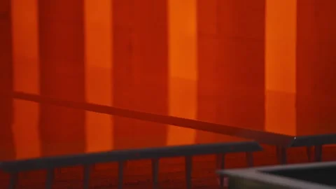 A red background with a black and white table in the foreground Stock Footage 302456696