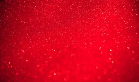 Red background of blurred hearts, side of defocus Stock Photos