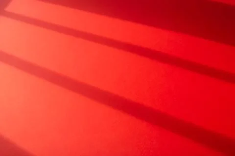 Red background with contrasting shadows Stock Photos