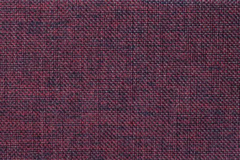 Red background of dense woven bagging fabric. Structure of the textile macro. Stock Photos