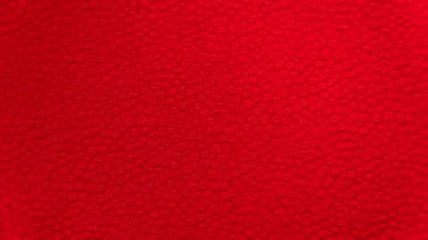 Red background fabric textiles with a small embroidery pattern Stock Photos