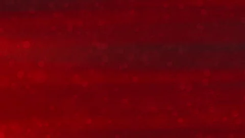 Red background features scattering particles and blurred lights Stock Footage 295724022