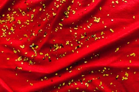 The red background. Glitters. Gold sequins Stock Photos