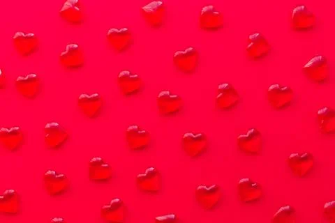 Red background with hearts pattern, flat lay Stock Photos