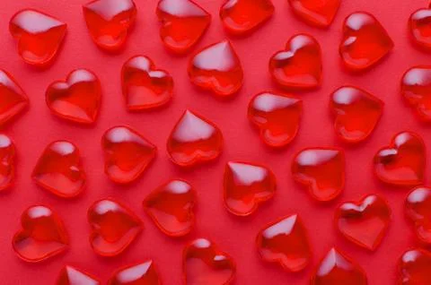 Red background with hearts pattern, flat lay, closeup Stock Photos