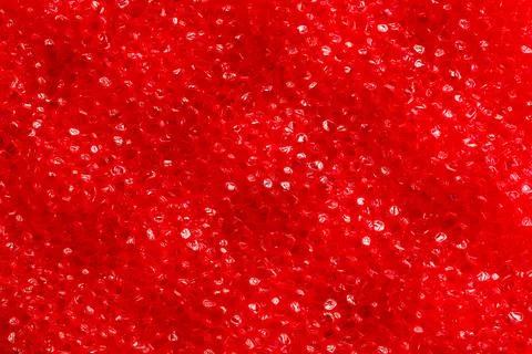 A red background with many small red dots Stock Photos