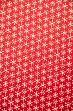 Red background with small snowflake pattern for christmas design Stock Photos