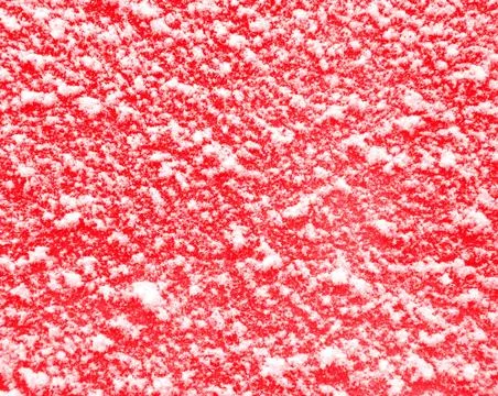 Red background with snow. Stock Photos
