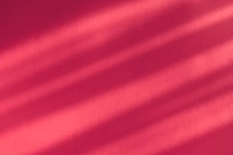 Red background with stripes from shadow of a sun. Stock Photos