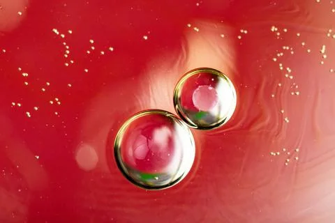 On a red background, two circles with a gradient fill Stock Photos