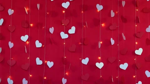 Red background with white hearts and flashing garland lamps Stock Footage 168109116