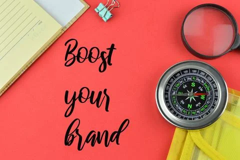Red background written with text BOOST YOUR BRAND. Stock Photos