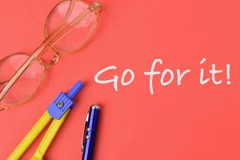 Red background written with text GO FOR IT. Stock Photos