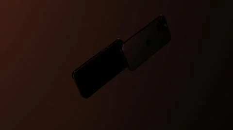 Red background.Design. A bright background on which the iPhone 13 appears in the Stock Illustration