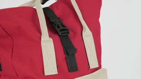 Red backpack bag rotates on white backgr... | Stock Video | Pond5