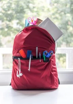 Red backpack with school supplies Stock Photos