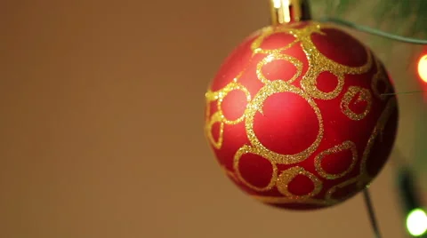 Red ball on the Christmas tree with blinking garlands Stock Footage 66358648