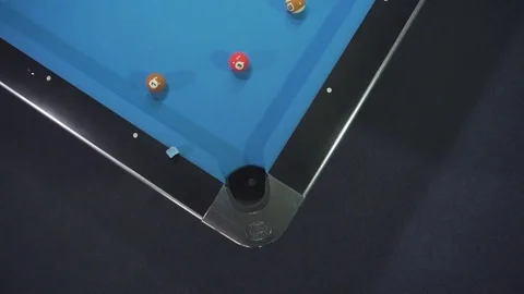 Red ball into the hole Stock Footage 78390788