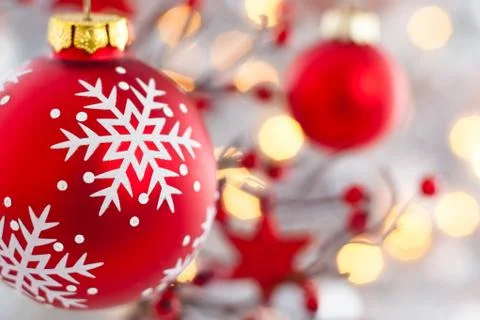 Red  ball with snowflake hanging on tree. Stock Photos
