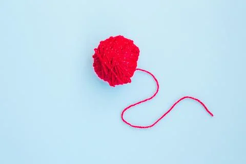 Red ball of woolen thread on light background Stock Photos