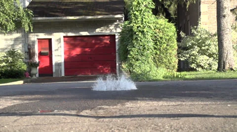 Red Balloon Explodes on Roadway Stock-Footage 26250997