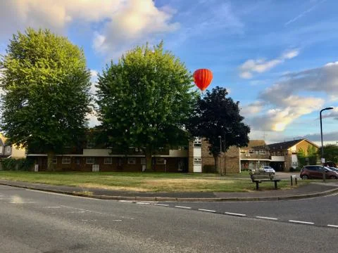 Red balloon over the buildings Stock Photos