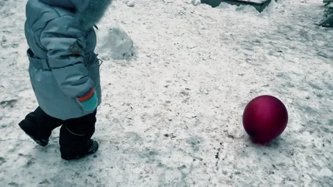 Red balloon rolls by the wind across the playground Stock Footage 147974136