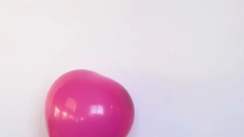 Red balloon in shape of heart inflating and deflating slowly video, symbol of Stock Footage 170332646