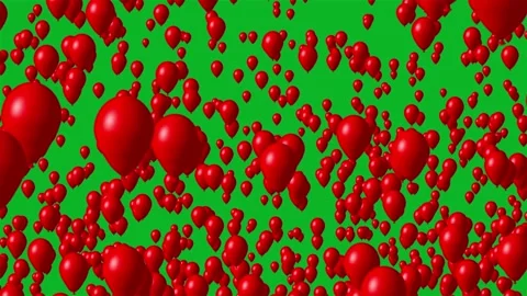 Red balloons flying on the green screen Stock Footage 135597651