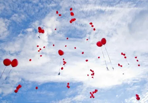 Red balloons flying to the sky Stockfoto's