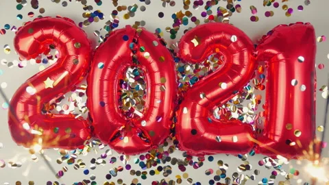 Red balloons in the form of numbers on a white background, falling confetti Stock Footage 144688689