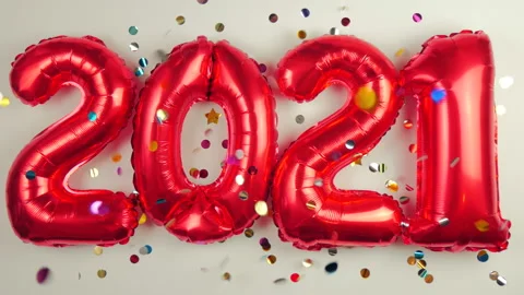 Red balloons in the form of numbers on a white background, falling confetti Stock Footage 144688736