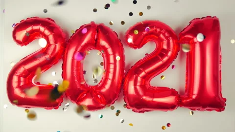 Red balloons in the form of numbers on a white background, falling confetti Stock Footage 144689605