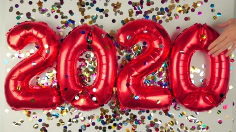 Red balloons in the form of numbers on a white background, falling confetti Stock Footage 144691305