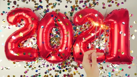 Red balloons in the form of numbers on a white background, falling confetti Stock Footage 144691384