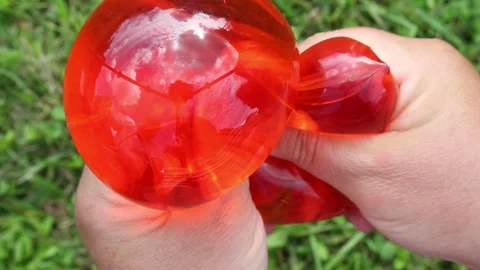 Red balloons pressed and stretched in playful motion Video stock 318068181