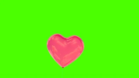 Red balloons in the shape of a heart flying on a green screen Stock Footage 169996393