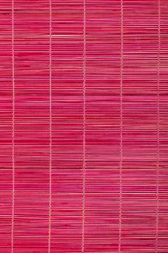 Red bamboo mat, background Stock-Fotos
