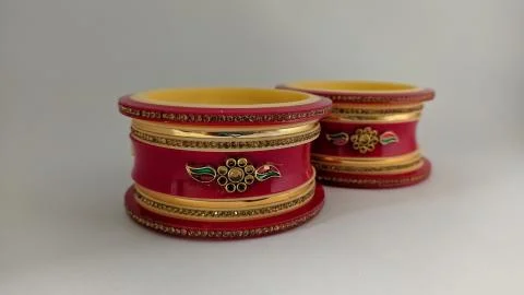 Red bangles isolated on white background - wedding  Traditional gold bangles Stock Photos