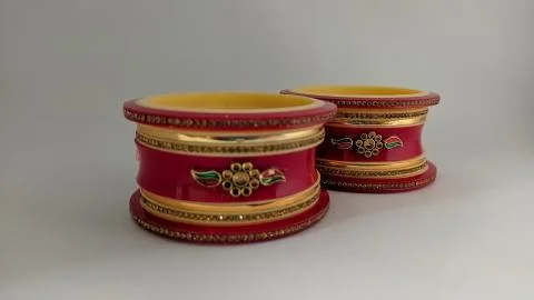 Red bangles isolated on white background - wedding  Traditional gold bangles Stock Photos