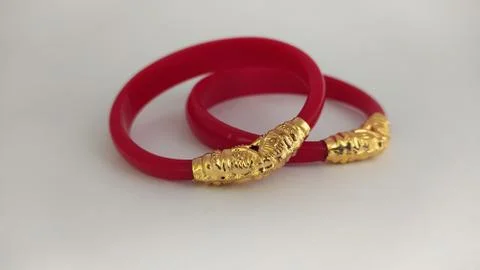 Red bangles isolated on white background - wedding  Traditional gold bangles Stock Photos