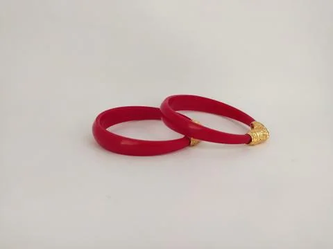 Red bangles isolated on white background - wedding  Traditional gold bangles Stock Photos