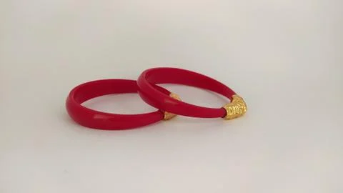 Red bangles isolated on white background - wedding  Traditional gold bangles Stock Photos