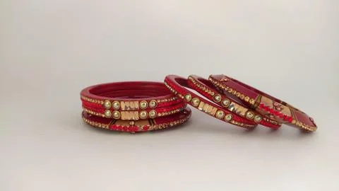 Red bangles isolated on white background - wedding  Traditional gold bangles Stock Photos