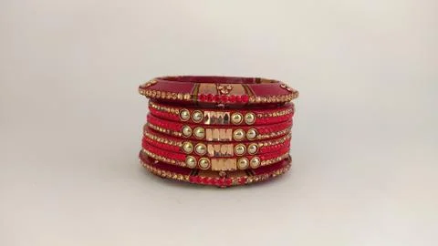 Red bangles isolated on white background - wedding  Traditional gold bangles Stock Photos